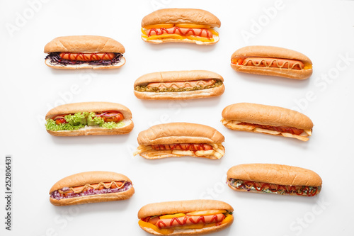 Photography Tasty hot dogs on white background