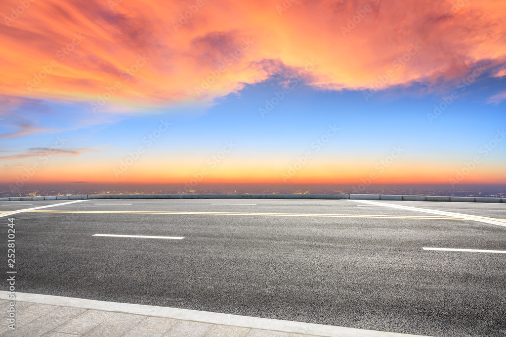 Fototapeta premium Asphalt road through the modern city above in Shanghai at sunset
