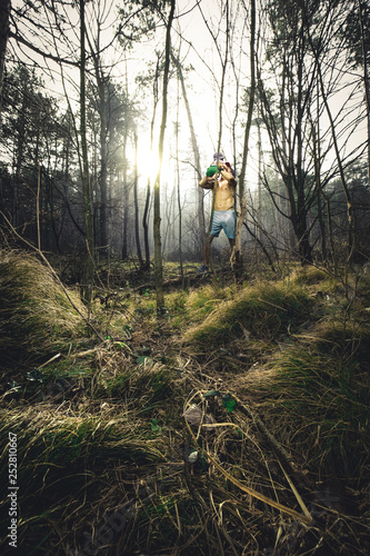 fitness model with baby in the morning in the forest with fog