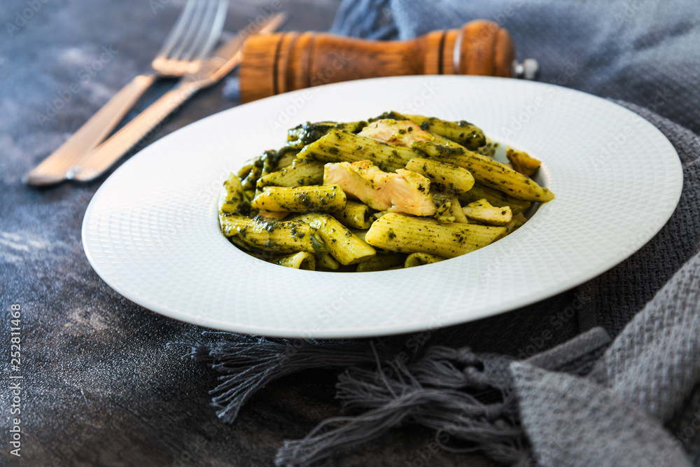 Pasta with pesto sauce and nuts on a the table Pasta with pesto sauce and nuts on a the table