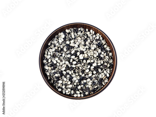 Split Black Lentil Also Know as Black Gram, Black Urad Dal, Vigna Mungo, Urad Bean, Urad Dal, Minapa Pappu, Mungo Bean or Black Matpe Bean Isolated on White Background photo