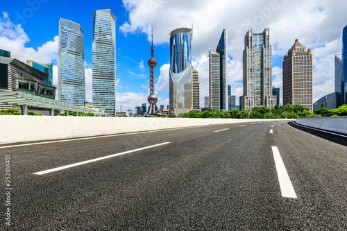 Asphalt road passes through Shanghai Lujiazui Financial District
