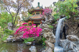 pavilion and waterfall in oriental garden in Hong Kong, China