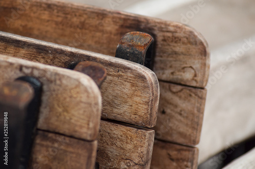 closeup of vintage wooden tables pile at restaurant terrace