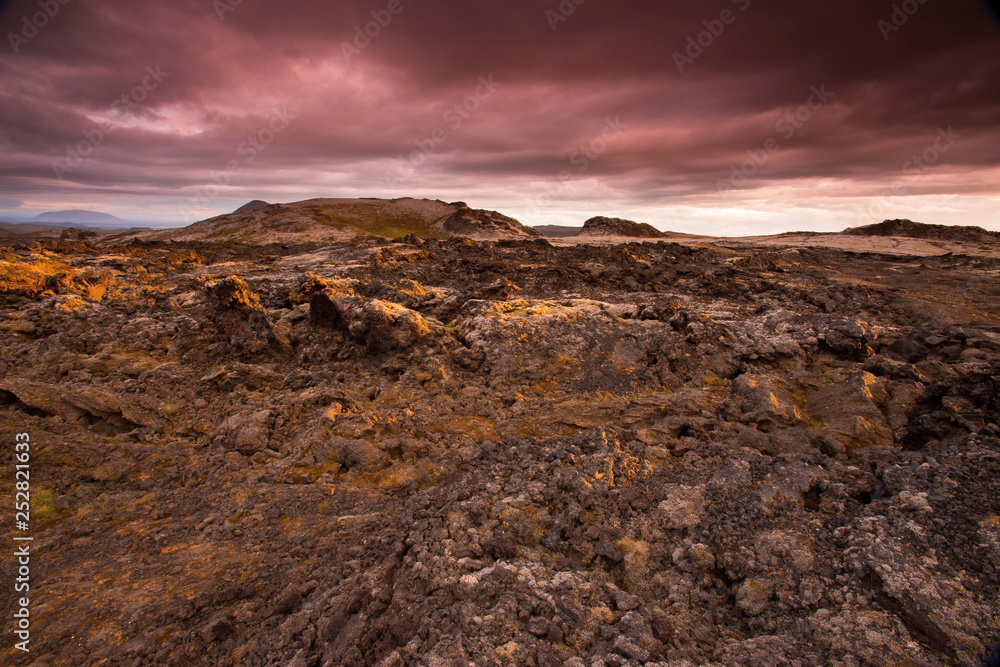 The Krafla is volcanic area in Iceland. Amazing lava field and dramatic sky with dark clouds.