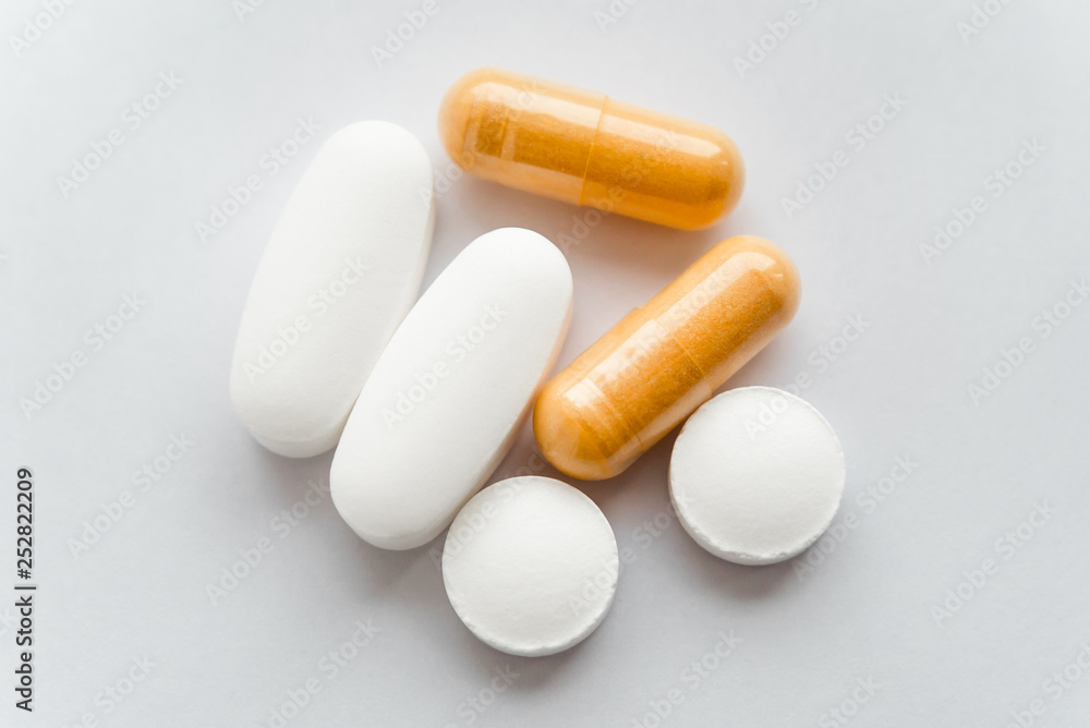 The photo of several tablets on a white background The photo of several tablets on a white background