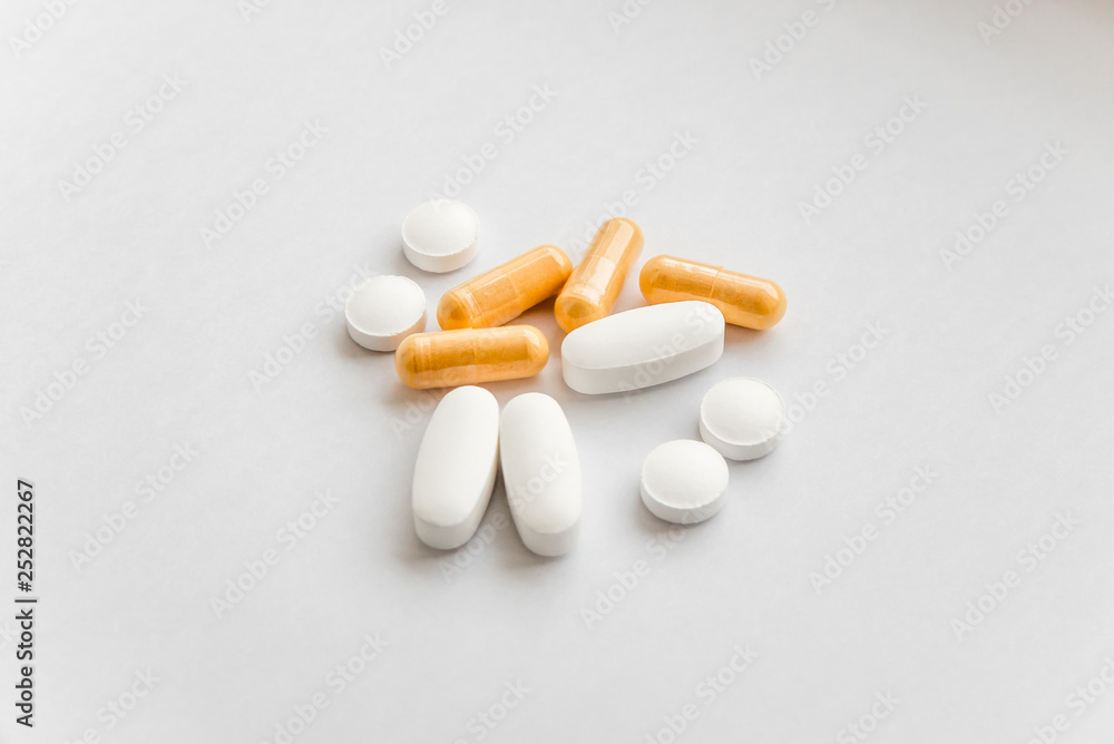 The photo of several tablets on a white background The photo of several tablets on a white background