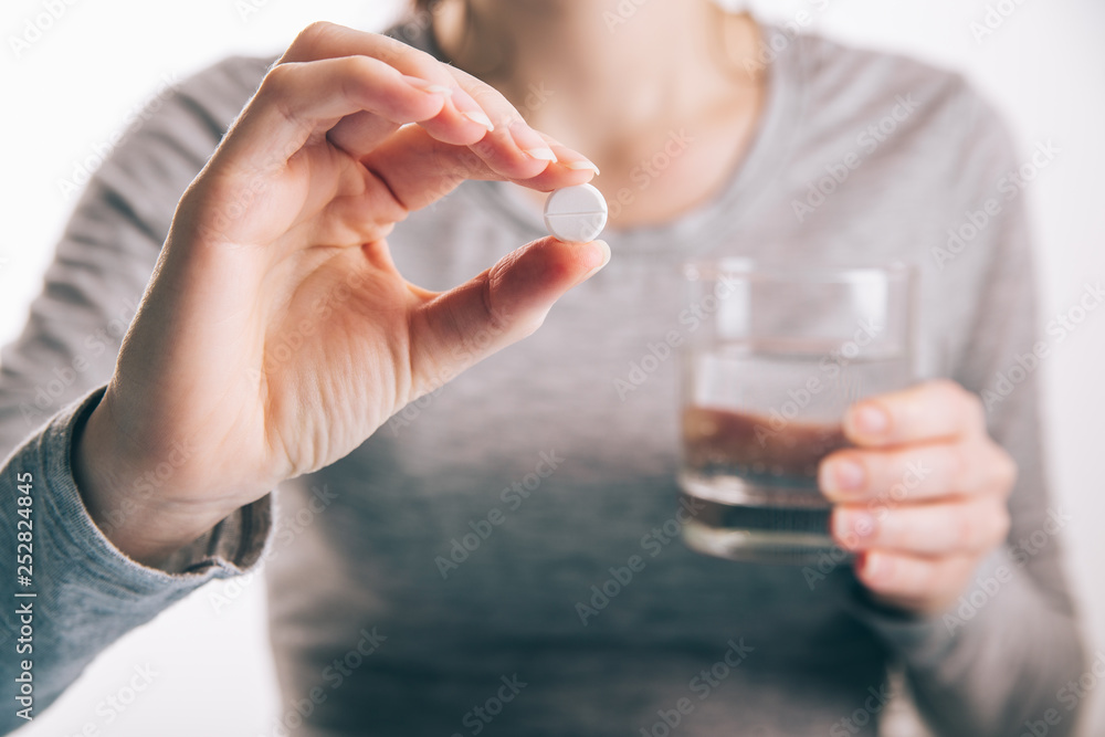 Woman drink pills in morning Woman drink pills in morning