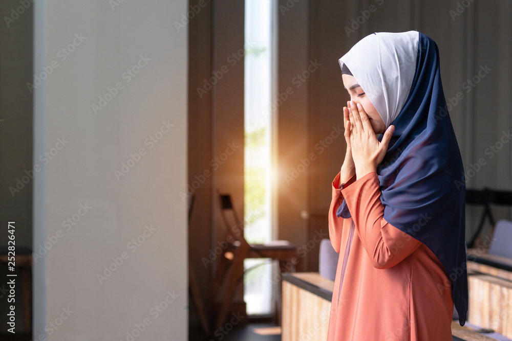 Muslim woman praying in public, concept religion of Islam Muslim woman praying in public, concept religion of Islam