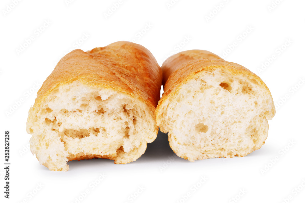 Baguette bread is broken in half on a white background