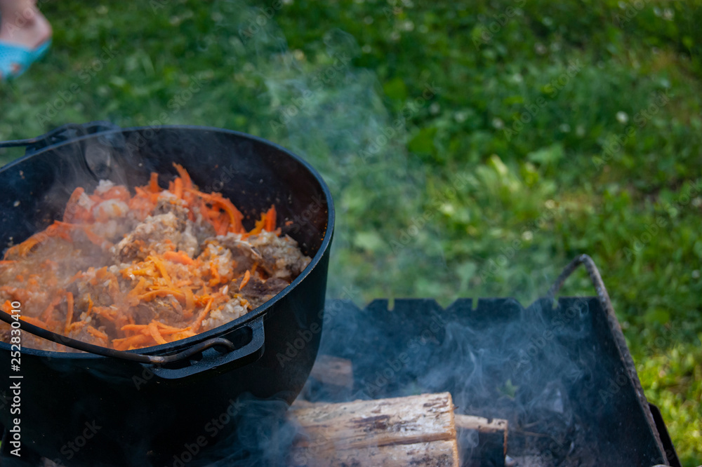 Pilaf on the grill during the trip. In the fresh air. Pilaf on the grill during the trip. In the fresh air.