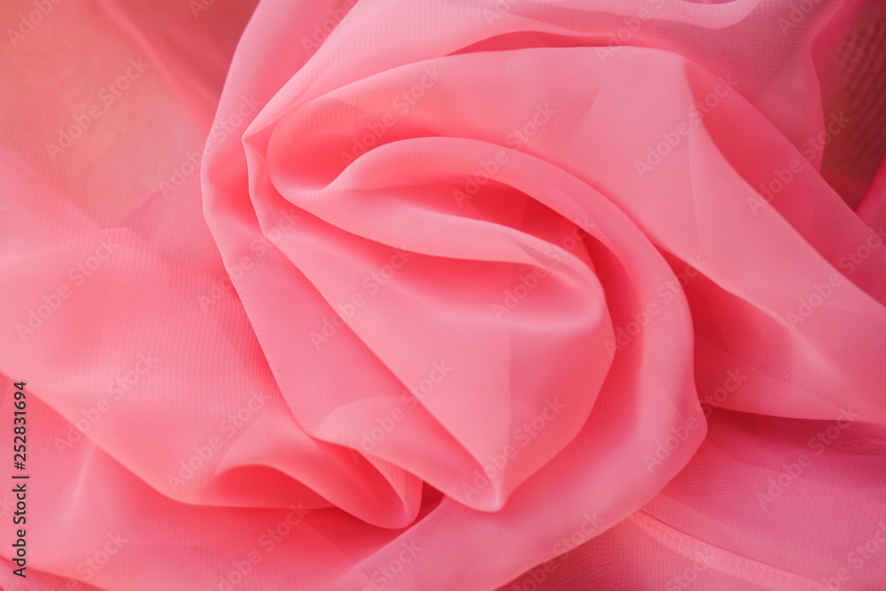 Pink georgette fabrics. The purple texture of the pleated fabric.. Pink georgette fabrics. The purple texture of the pleated fabric..