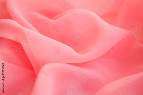 Embossed fabric, pleated. Pink material textile..