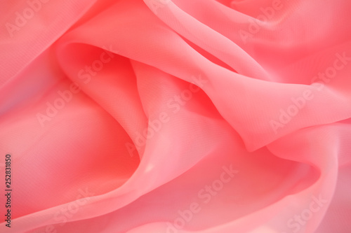 Embossed fabric, pleated. Pink material textile...