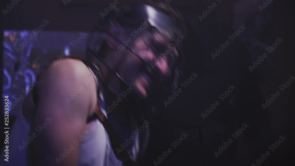 Close up of an inmate in restraining helmet getting beat by two guards, 4k Close up of an inmate in restraining helmet getting beat by two guards, 4k