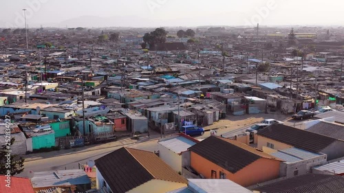 Aerial over Gugulethu, one of the poverty stricken slums, ghetto, or townships of South Africa. photo