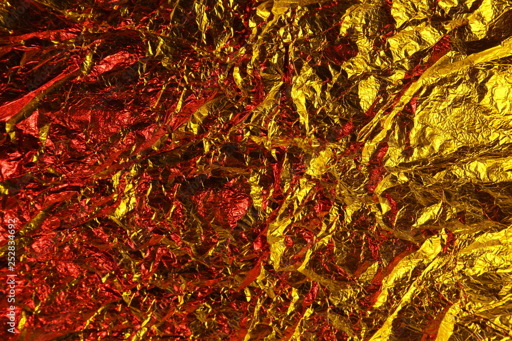 abstract background metal aluminum foil gold yellow and red colors abstract background metal aluminum foil gold yellow and red colors