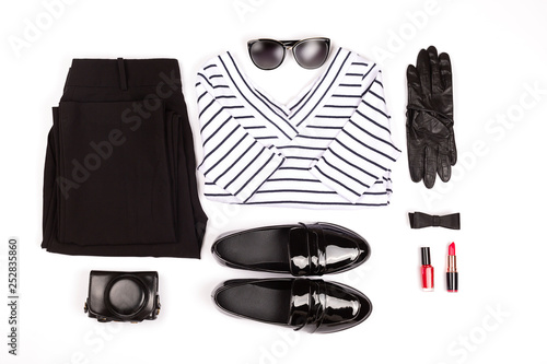 French style monochrome outfit of the day. Minimal and elegant clothes set. Flat lay, top view. Horizontal.