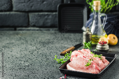 Fresh sliced meat on cast iron griddle. Selective focus, space for text. photo