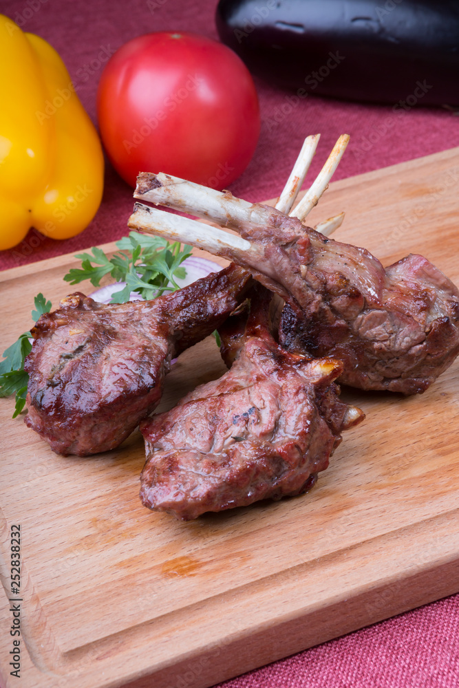 Grilled juicy lamb chop served with ketchup