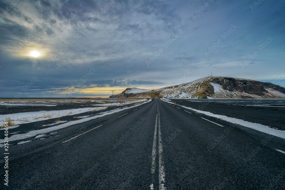 driving through iceland with empty highway