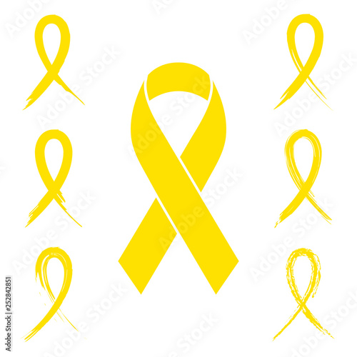 Yellow ribbon set with ink, paint brush and charcoal style isolated on white. Collection of flat design yellow awareness ribbons in seven different style.