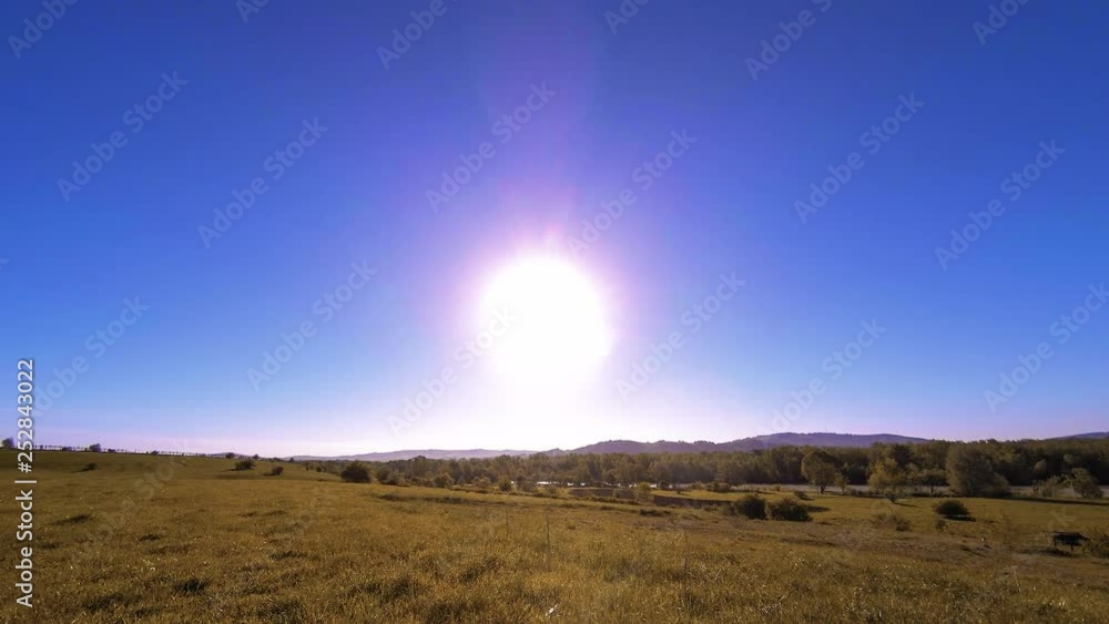 4K UHD mountain meadow timelapse at the summer. Clouds, trees, green grass and sun rays movement. 4K UHD mountain meadow timelapse at the summer. Clouds, trees, green grass and sun rays movement.