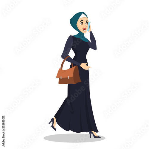 Arab business woman. Lady in hijab walking