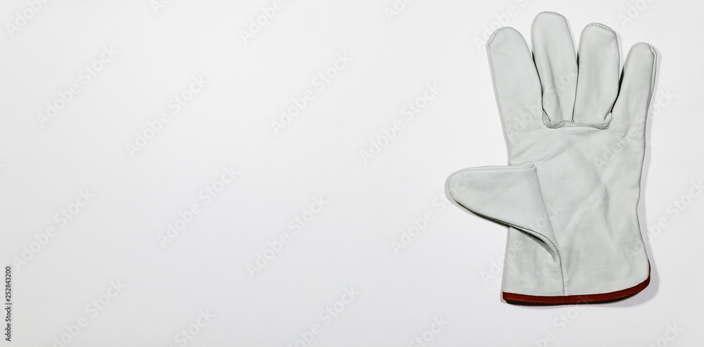 Pair of white glove on white wooden plank, DIY Concept. Pair of white glove on white wooden plank, DIY Concept.
