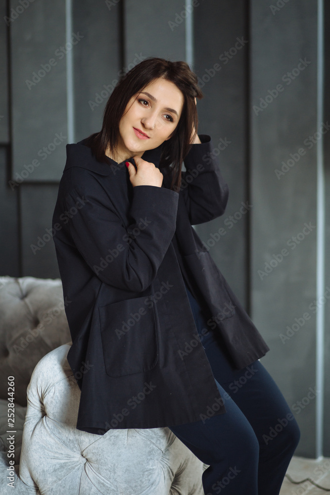 Modern business woman in the office sitting on the sofa Modern business woman in the office sitting on the sofa