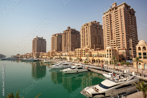 DOHA, QATAR – SEPTEMBER 06 2013: Mediterranean-style towers in Porto Arabia, The Pearl Qatar. © VonWyliPhotography