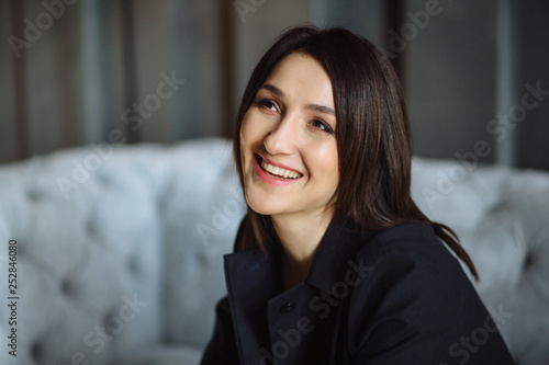Free Download Modern business woman in the office sitting on the sofa - GFXLoad