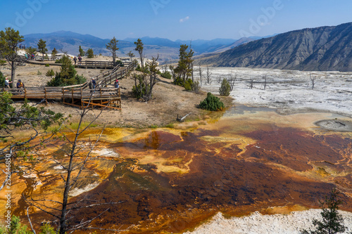Yellowstone National Park, WY, USA - August 28th, 2017: Tourists at Mammoth Hot Springs