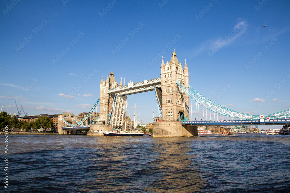 View of Tower Bridge on the River Thames opening for the Lord Nelson
