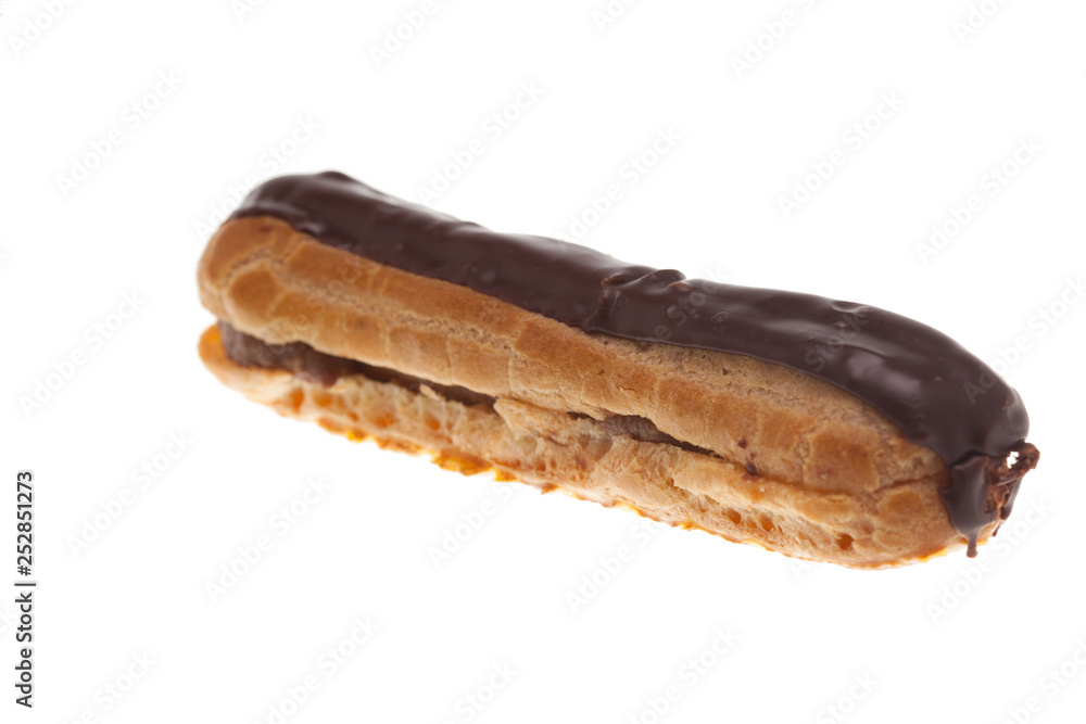 Delicious chocolate eclaire isolated over white background Delicious chocolate eclaire isolated over white background