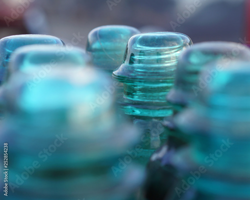 Blue glass electrical insulators