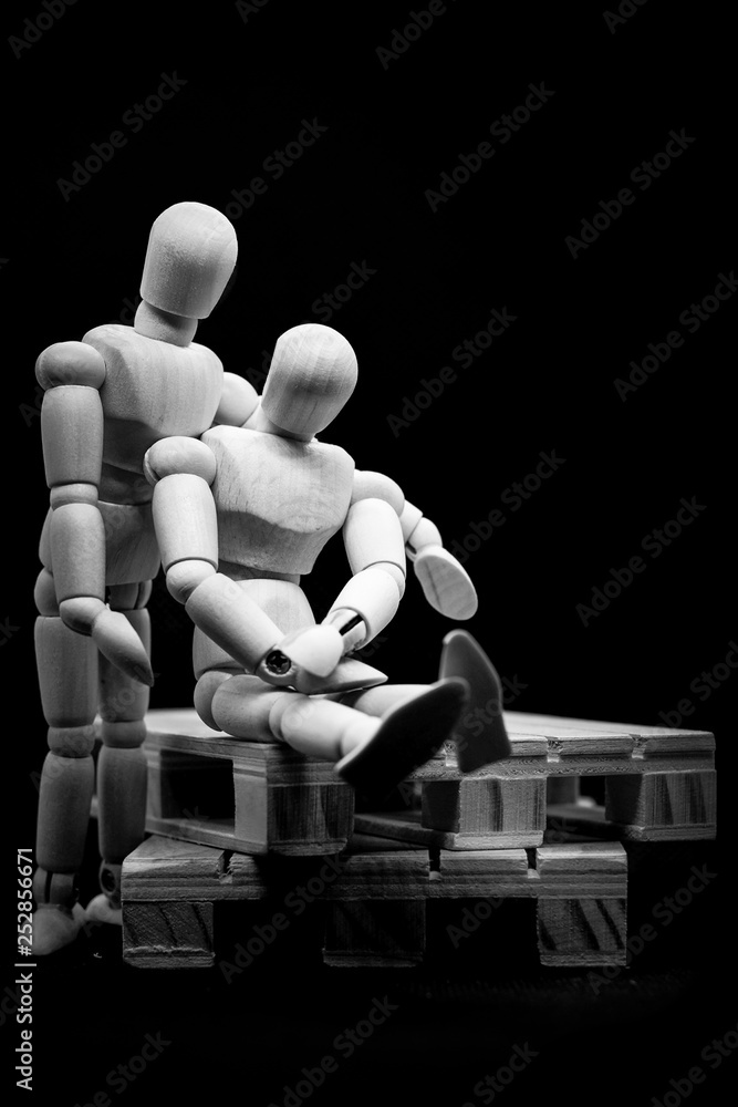 figures on a white background, one taking care of the other figures on a white background, one taking care of the other