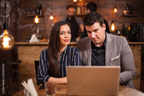Two business people having a meeting in a coffee shop