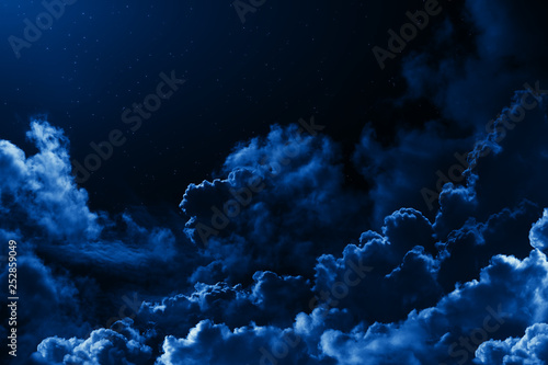 Obraz na płótnie Mystical midnight sky with stars surrounded by dramatic clouds