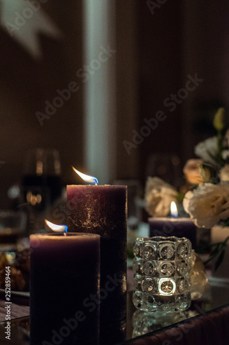 candles on the wedding table are burning © Yevhenii
