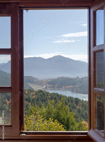 View from the window to the lake and mountains