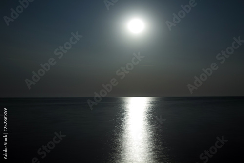 Moon above the water with moonlight