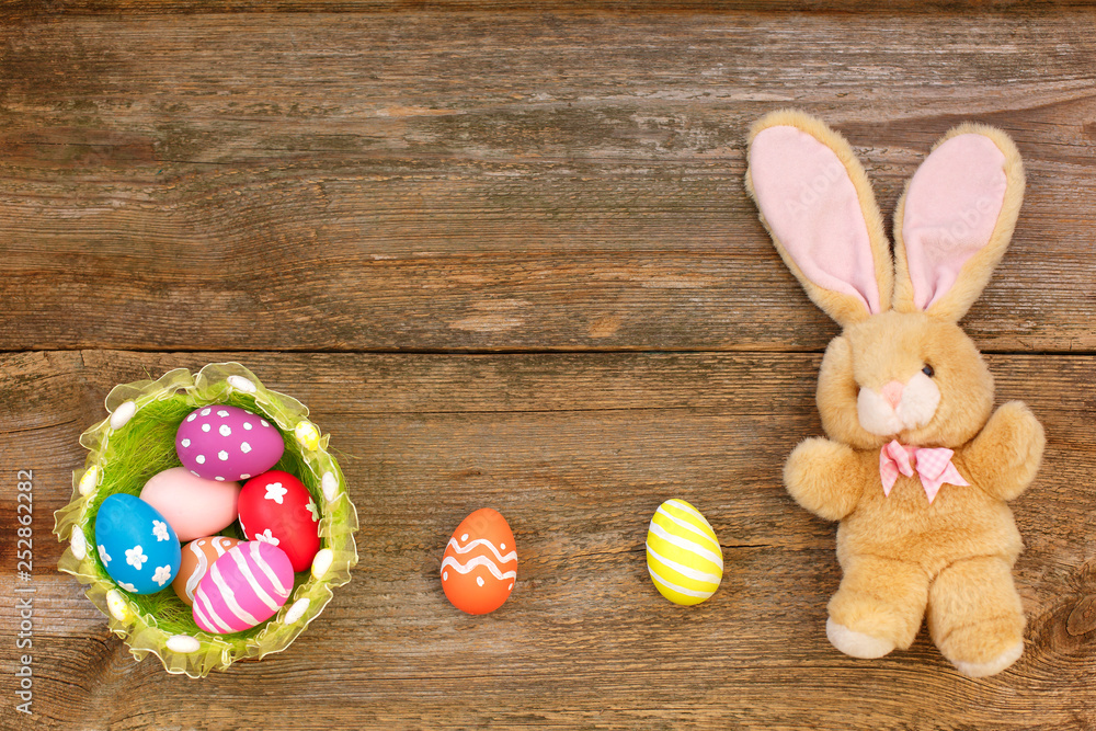 Easter concept. Easter bunny decorative with eggs on wooden background. top view, copy space.E aster Flat lay. S Easter concept. Easter bunny decorative with eggs on wooden background. top view, copy space.E aster Flat lay. S