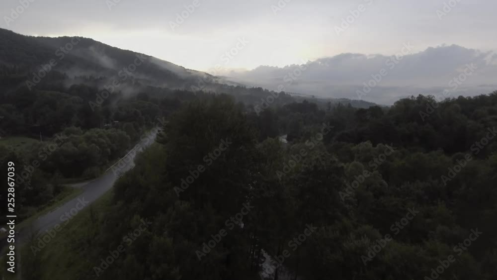 Aerial view of foggy mountain and forest after rain Aerial view of foggy mountain and forest after rain