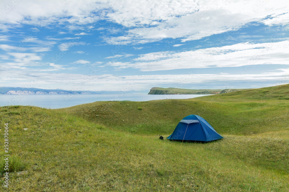 Landscape with tent on the shore of the lake Baikal