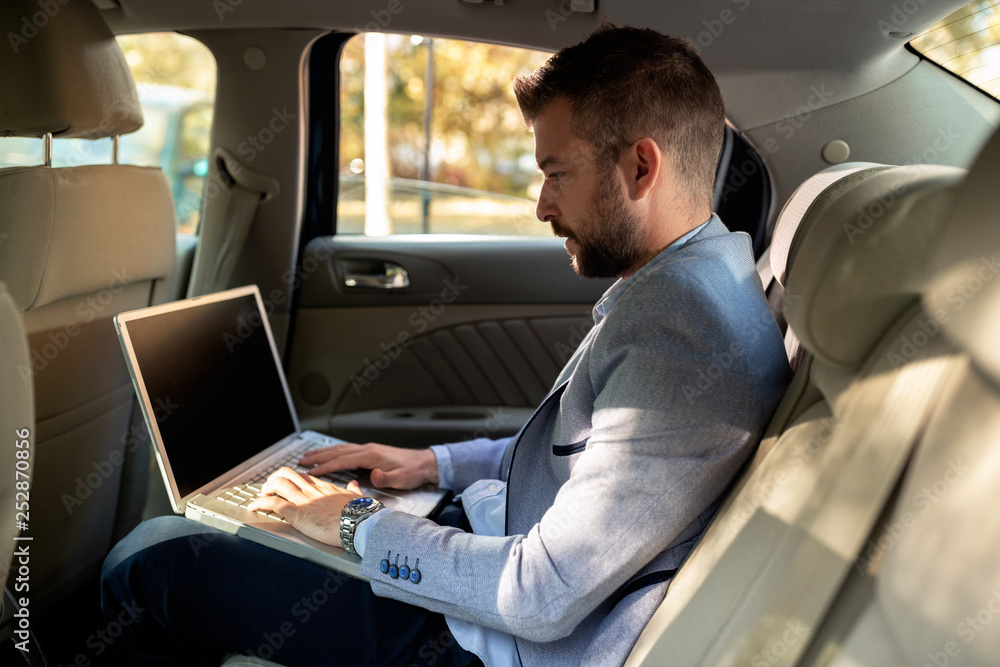 Creative businessman typing work reports Creative businessman typing work reports