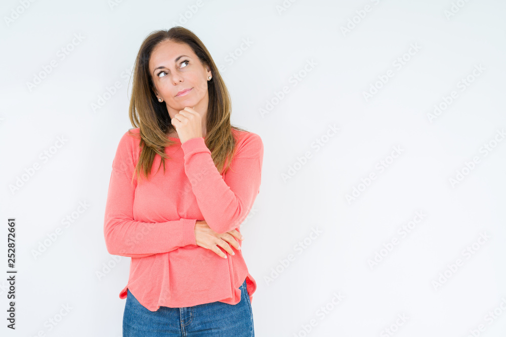 Beautiful middle age woman over isolated background with hand on chin thinking about question, pensive expression. Smiling with thoughtful face. Doubt concept. Beautiful middle age woman over isolated background with hand on chin thinking about question, pensive expression. Smiling with thoughtful face. Doubt concept.