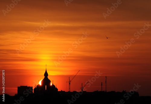 The silhouette of ortodox church in sunrise