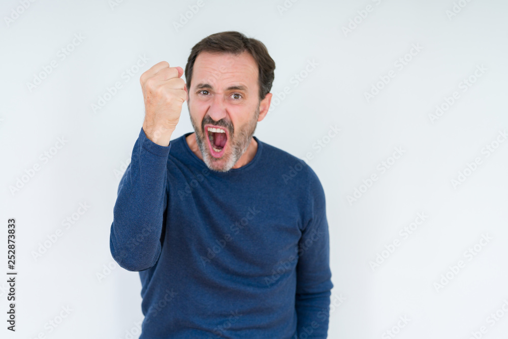 Elegant senior man over isolated background angry and mad raising fist frustrated and furious while shouting with anger. Rage and aggressive concept. Elegant senior man over isolated background angry and mad raising fist frustrated and furious while shouting with anger. Rage and aggressive concept.