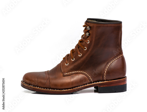 Men’s brown boot isolated on a white background.